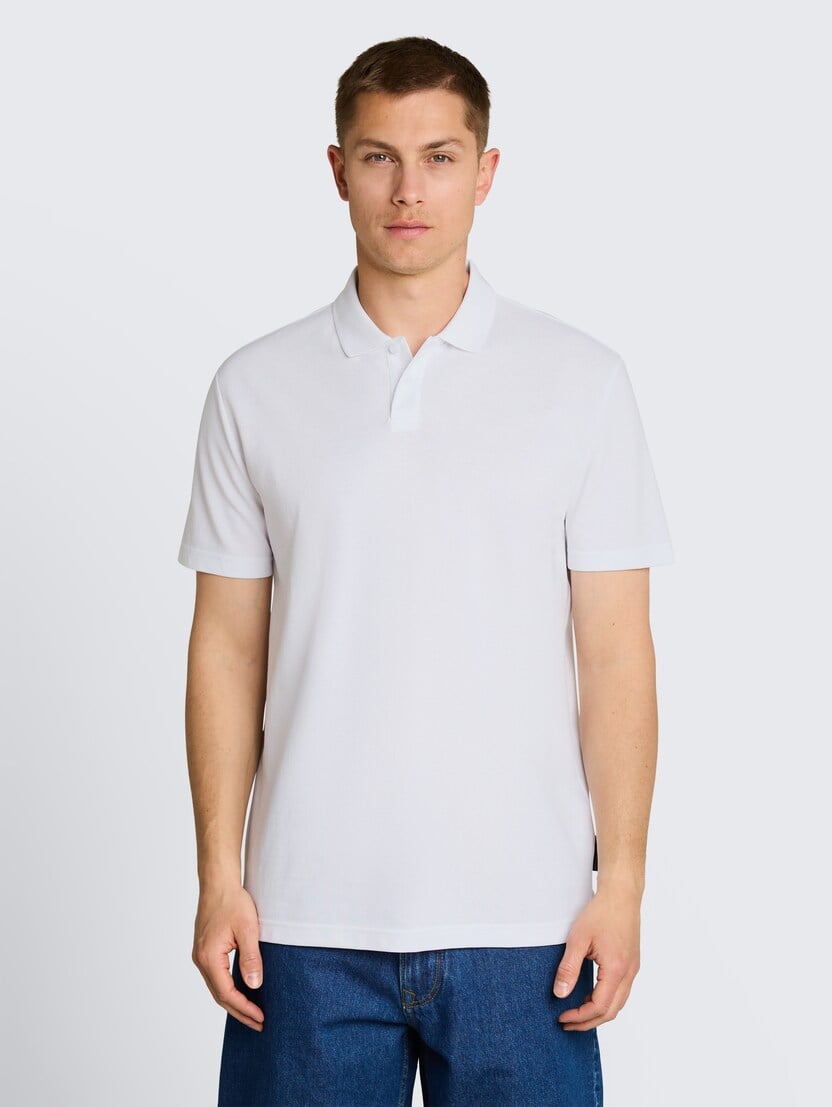 Strukturirana polo majica - Bela_6737093